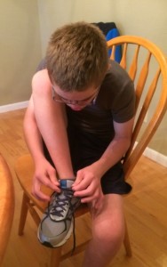 occupational therapy helps Colin tie his shoes